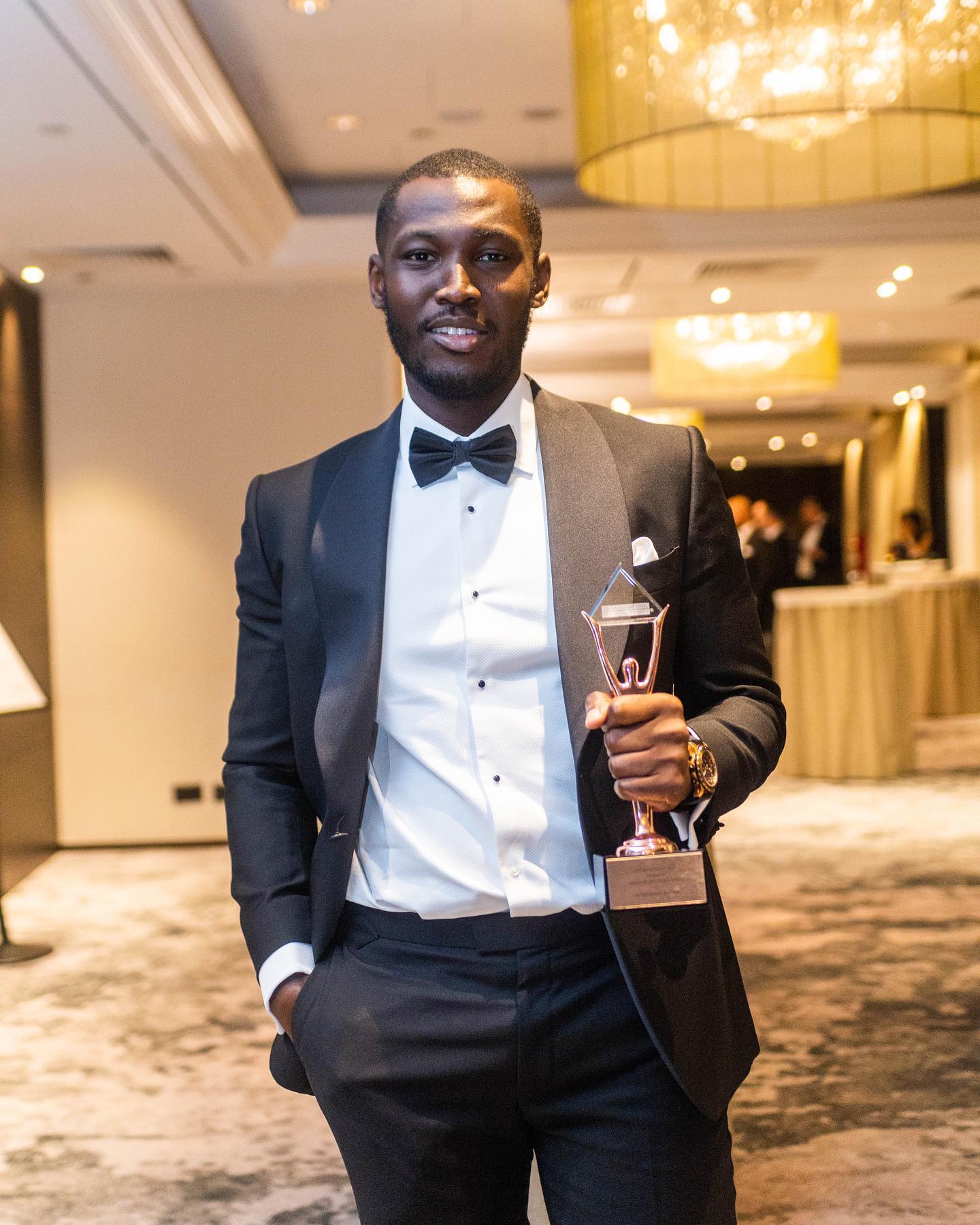 Alfred Dzadey holding his Best New Property Investor of the Year award
